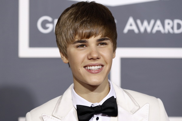 Justin Bieber poses on arrival at the 53rd annual Grammy Awards in Los Angeles